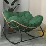 Миниатюра Кресло-качалка из ротанга на балконе